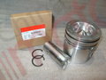 Поршень двигателя (ISBe,ISDe) V=4.5,6.7 {+0.50} E-3 в сборе {поршень,палец,кольца поршневые,кольца стопорные} "Аналог"